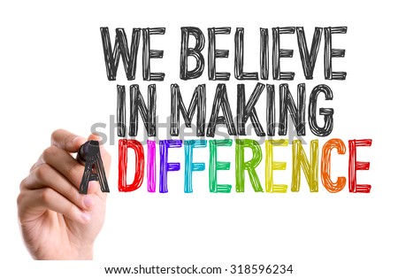 Hand with marker writing: We Believe in Making a Difference Royalty-Free Stock Photo #318596234