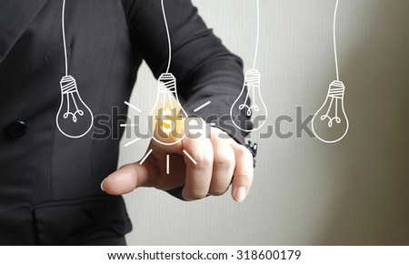 Businessman Touching  light bulb money , business idea
