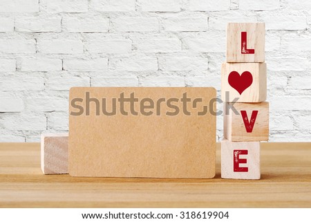Blank recycle paper business card and wooden cubes with love word background, template, mock up