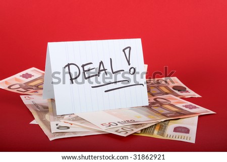 Deal sign and money on the table