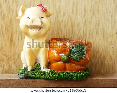 cute baked clay dolls for decorate garden and house still life on wooden background