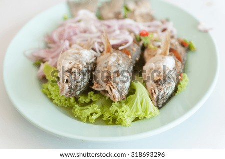 Dish with fried red mullet fish.Selective focus. Very shallow Depth of Field, for soft background.