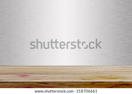 Empty wooden deck table over metal texture background