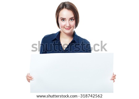 Portrait of an attractive young business woman in glasses holding blank card - over white background