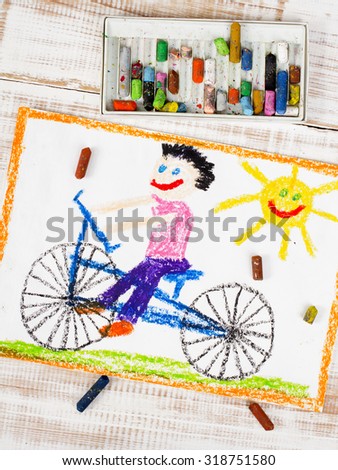 photo of colorful drawing: boy riding bike