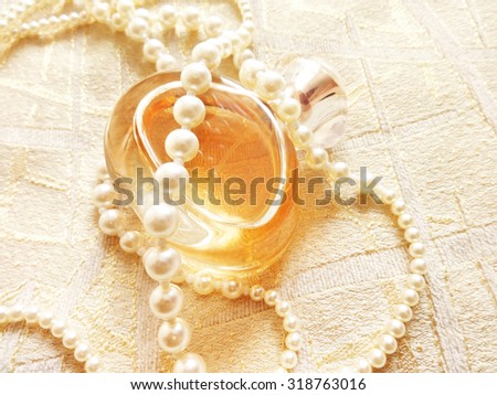 Women's perfume and pearls