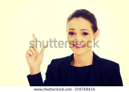 Beautiful happy businesswoman showing size with her fingers.