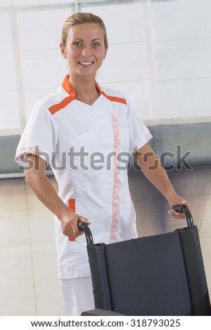 nurse pushing a wheelchair isolated on white background