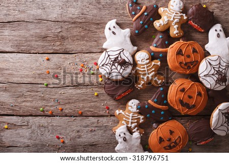 Funny delicious ginger biscuits for Halloween on the table. horizontal view from above
 Royalty-Free Stock Photo #318796751