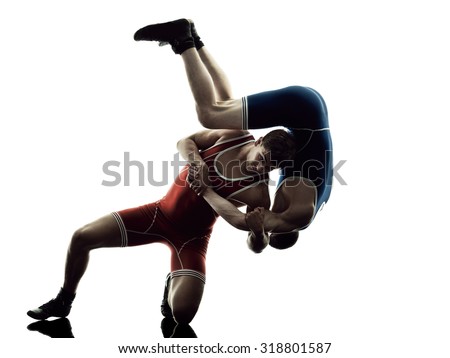 two caucasian wrestlers wrestling men on isolated silhouette white background Royalty-Free Stock Photo #318801587