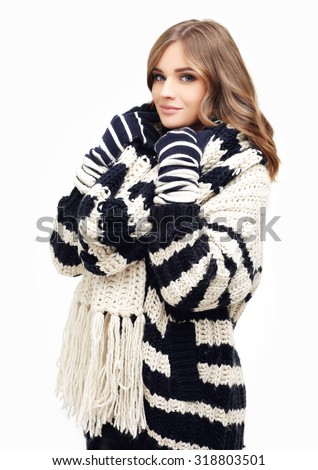 Studio portrait of smiling girl in winter outfit - sweater