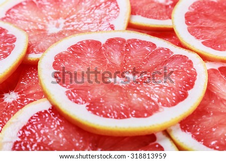 background with citrus-fruit of grapefruit slices. focus in the middle of the frame