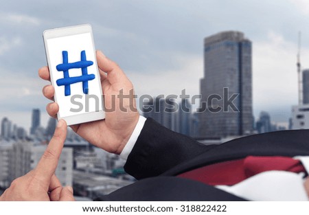 business man post has tag on smart phone