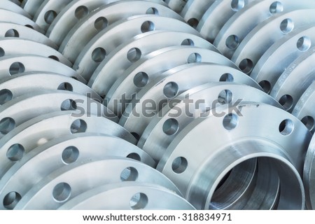 Flanges stacked in warehouse, selective focused Royalty-Free Stock Photo #318834971