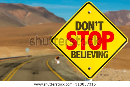 Don't Stop Believing sign on desert road