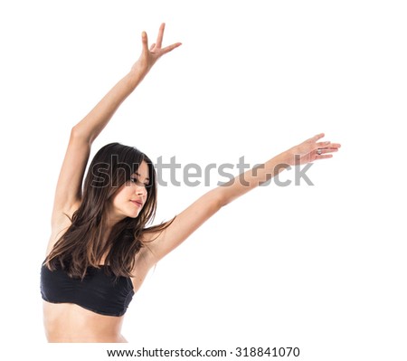 Young ballet dancer posing over white background