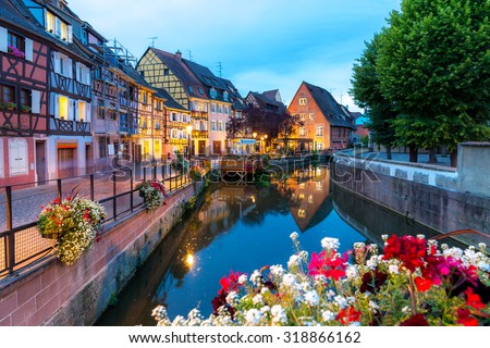 Colmar, Petit Venice, at dusk water canal and traditional colorful houses. Alsace, France. Royalty-Free Stock Photo #318866162