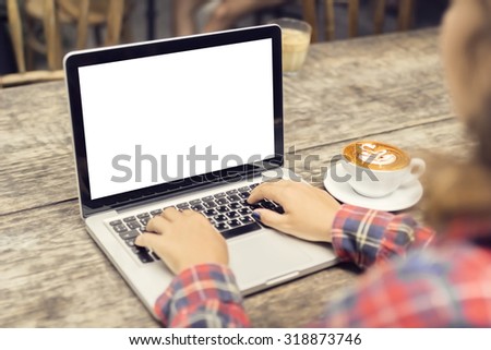 woman typing on a laptop with a cup of coffee, mock up