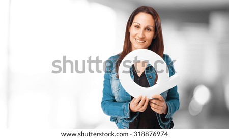 woman holding the Q letter