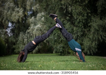 Girl practicing parkour and free running by making a pyramid