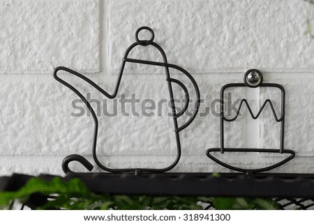 The wrought iron coffee and cake decoration