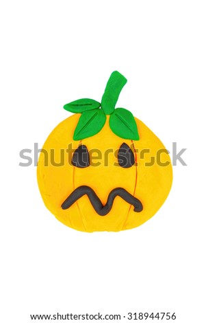 Pumpkin from children bright plasticine - Stock Image macro.