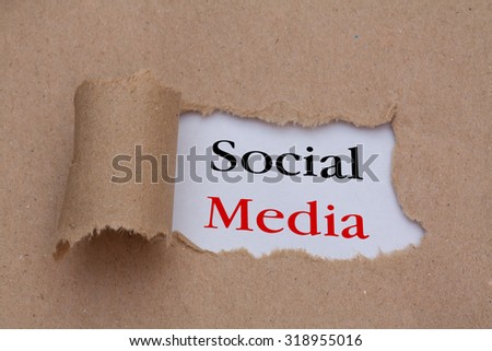 Social media text concept,torn brown paper