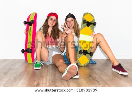 Happy friends with their skateboards