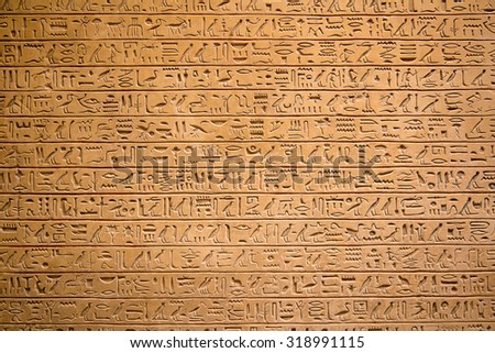 Egyptian hieroglyphs on the wall Royalty-Free Stock Photo #318991115