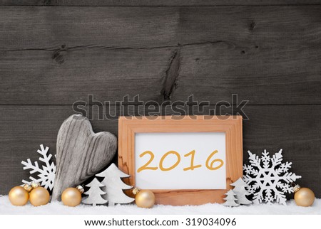 Golden Christmas Decoration On Snow. Heart, Christmas Tree Balls, Snowflake, Christmas Tree. Picture Frame With Text 2016. Rustic, Vintage Gray Wooden Background. Black And Withe Image
