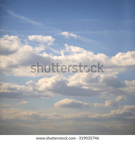 Natural color aerial overcast beautiful wallpaper background with bright blue open sky full of many small white clouds, square picture