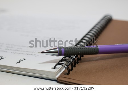Notebook and pencil 