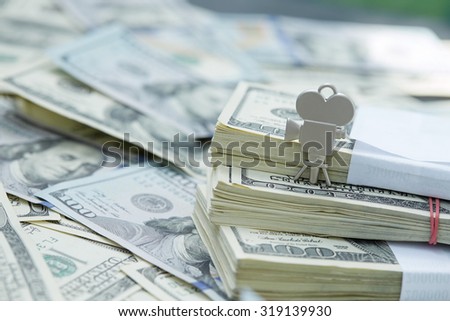 notes of dollars, movie camera