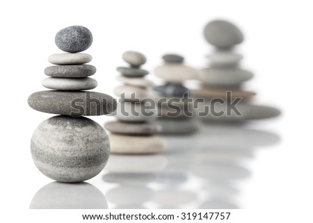 Group of balanced piles of different river stones