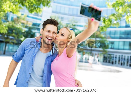 Couple taking a selfie with smartphone