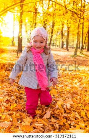 little cute girl playing in park