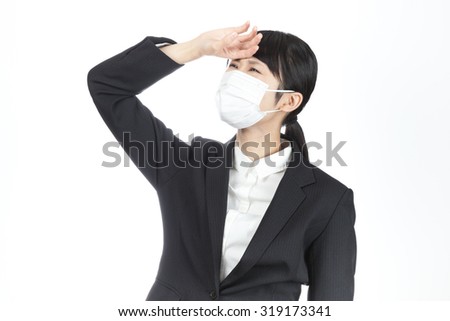 business woman, mask, hand on head