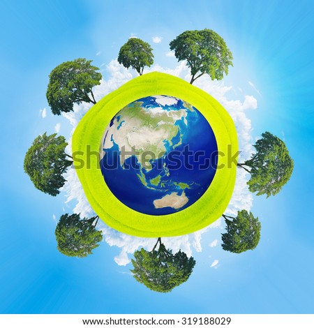 Green planet - Earth.tree around green earth,go green,save world concept. Elements of this image are furnished by NASA