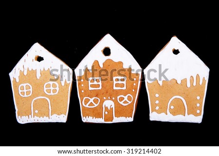  Homemade gingerbread cookies for Christmas on a black background