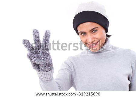 happy woman pointing up three fingers