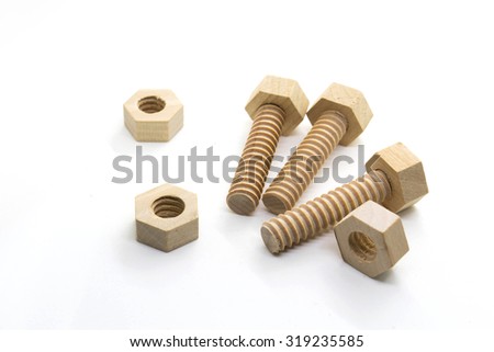 Wooden nuts and bolts isolated on white background