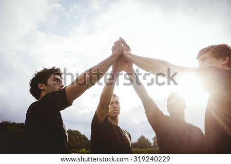 Rugby players standing together before match at the park Royalty-Free Stock Photo #319240229