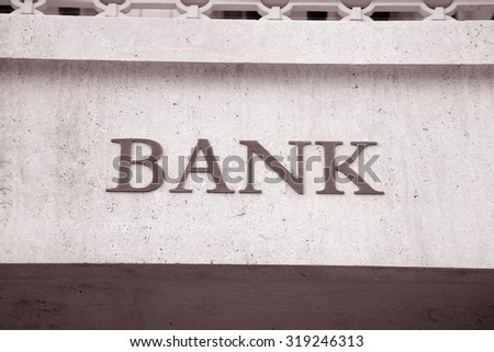 Bank Sign in Urban Setting in Black and White Sepia Tone