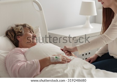Picture of granddaughter caring about ill grandma