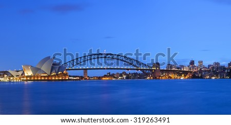The Harbour Bridge, Sydney Opera House and Central Business District of Sydney. Photographed at dawn.