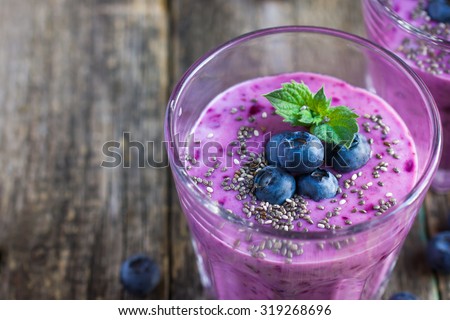 blueberry smoothie with chia seeds and fresh berry Royalty-Free Stock Photo #319268696