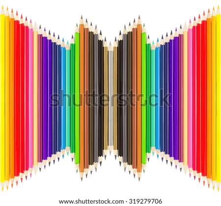 Colored pencils in rows on white background
