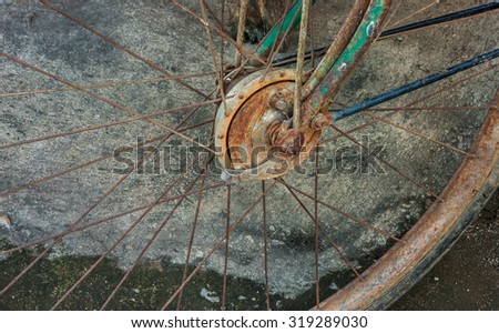 very old bicycle wheels. Background.