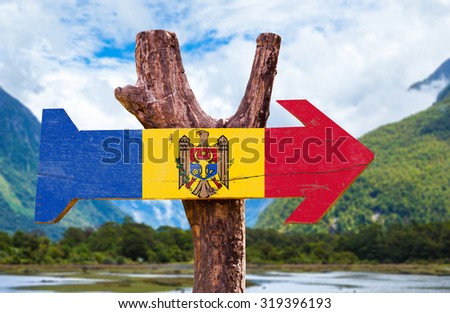 Moldova Flag wooden sign with countryside background