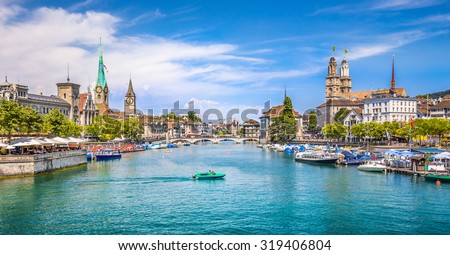 Panoramic view of historic Zurich city center with famous Fraumunster and Grossmunster Churches and river Limmat at Lake Zurich on a sunny day with clouds in summer, Canton of Zurich, Switzerland Royalty-Free Stock Photo #319406804